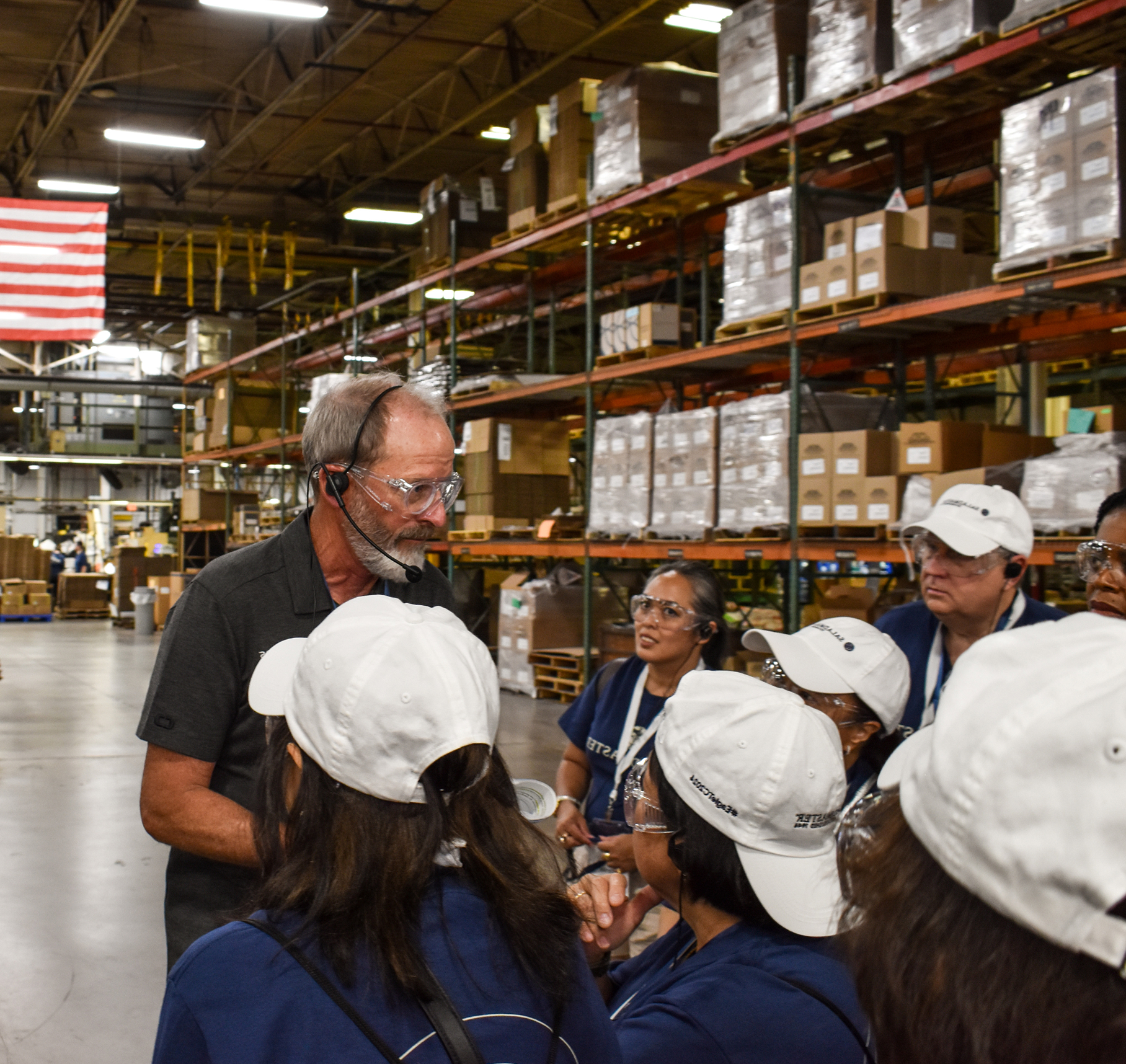 Sales team on a factory tour of the West Bend Company manufacturing facility