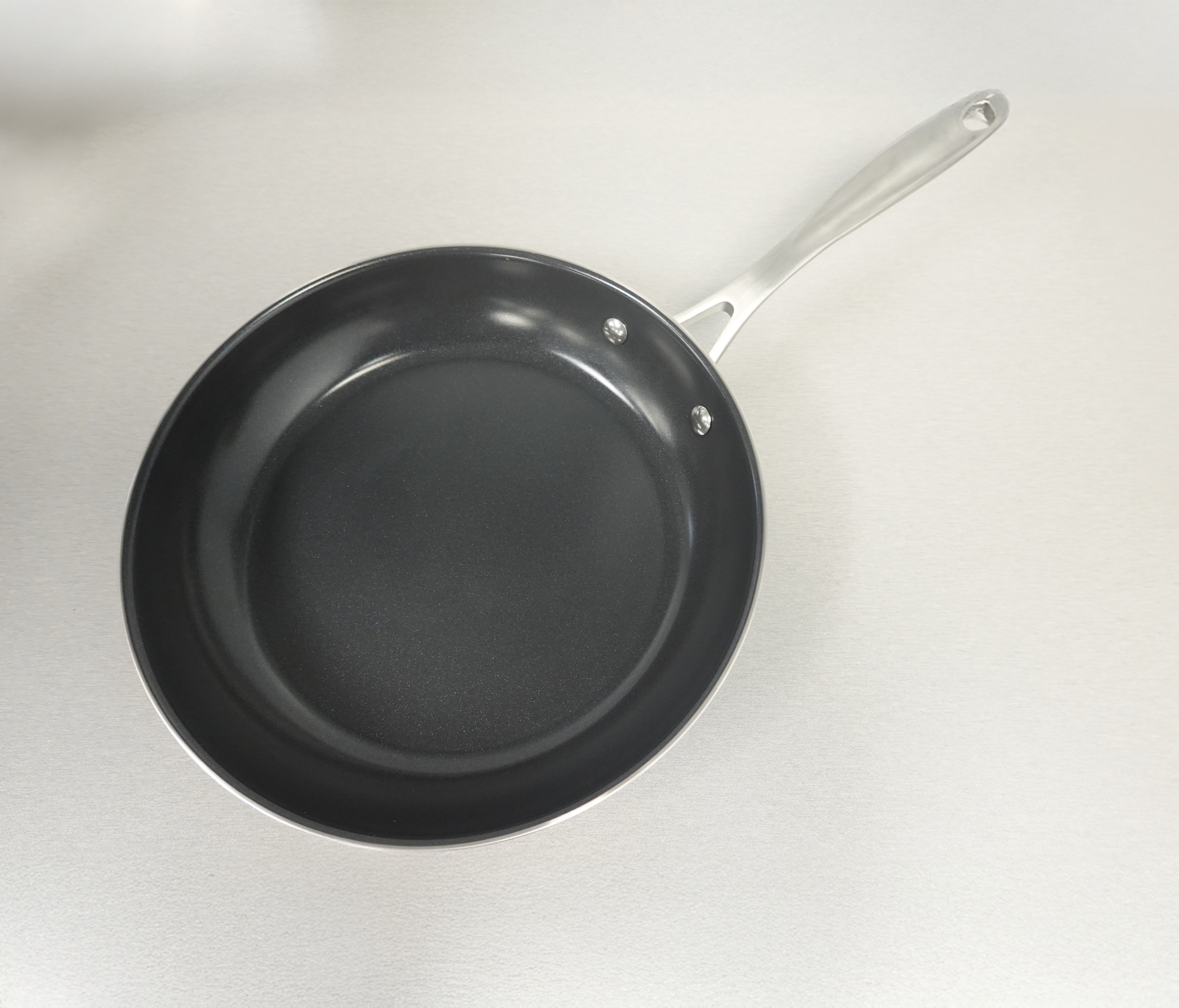Ceramic nonstick skillet on table.